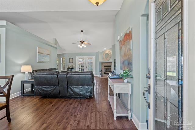 1607 Woodlawn Way, Gulf Breeze, FL 32563 - living room with french doors, ceiling fan, dark wood-style floors, lofted ceiling, and a glass covered fireplace