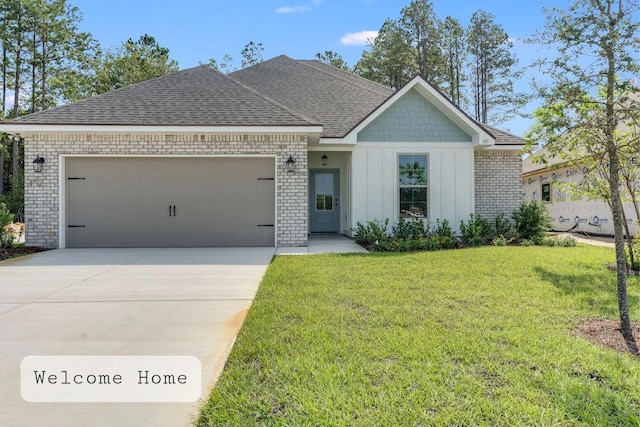 view of front of home featuring driveway, an attached garage, a front lawn, board and batten siding, and brick siding