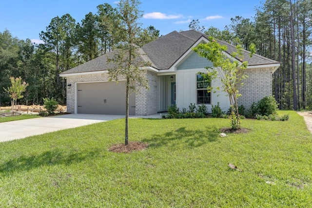 view of front facade with concrete driveway, an attached garage, brick siding, and a front yard