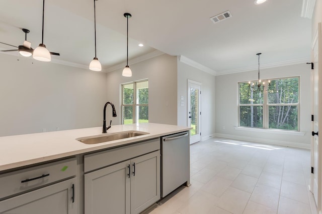 kitchen with dishwasher, pendant lighting, light countertops, and a sink