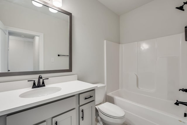 bathroom with vanity, bathing tub / shower combination, and toilet