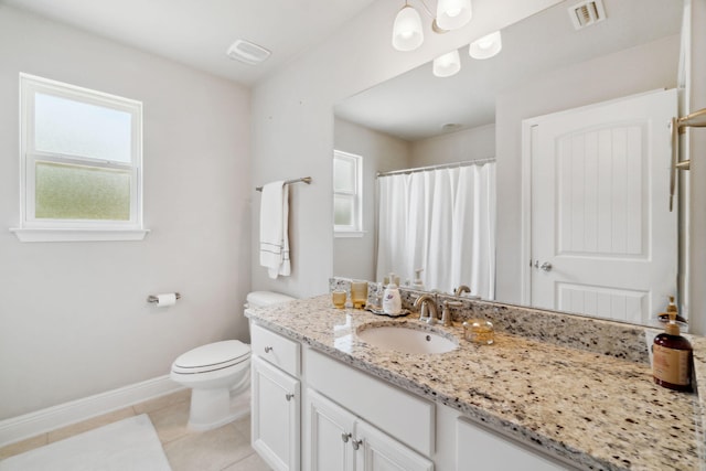 bathroom featuring tile patterned floors, toilet, a healthy amount of sunlight, and visible vents