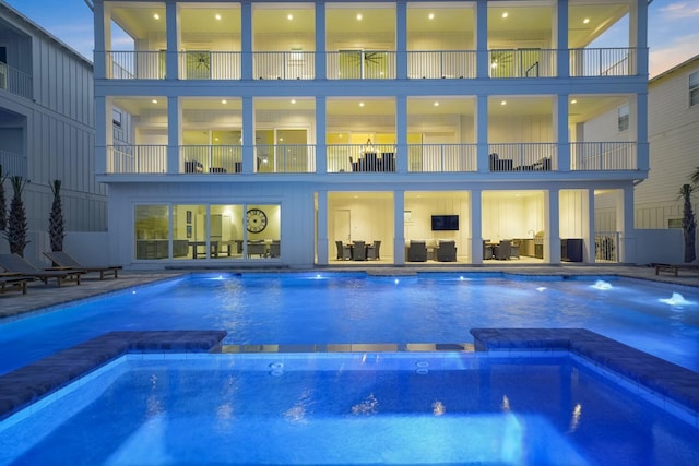 view of pool featuring a patio area and a pool with connected hot tub