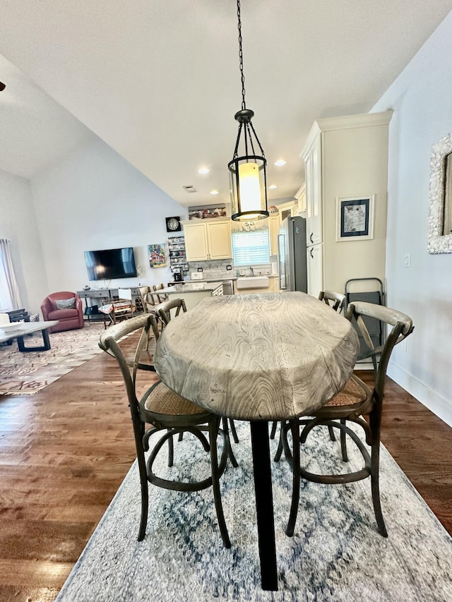 dining area featuring recessed lighting, dark wood-style floors, baseboards, and a healthy amount of sunlight