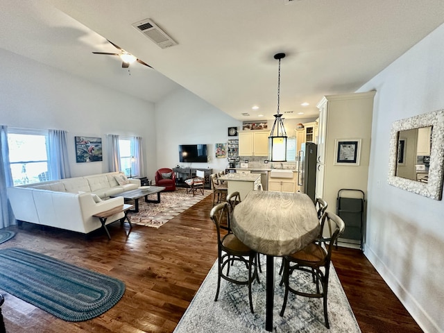 dining area with ceiling fan, visible vents, lofted ceiling, and dark wood-style floors