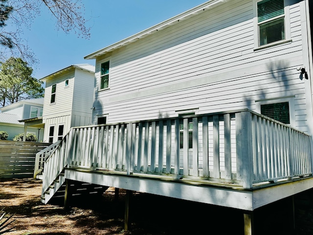 rear view of house featuring a deck