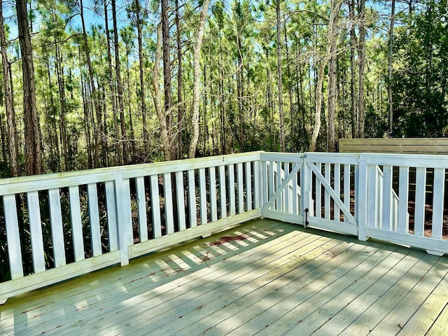 deck featuring a view of trees