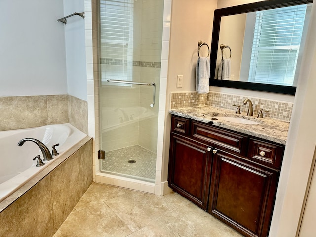 full bathroom featuring vanity, decorative backsplash, a shower stall, tile patterned floors, and a bath