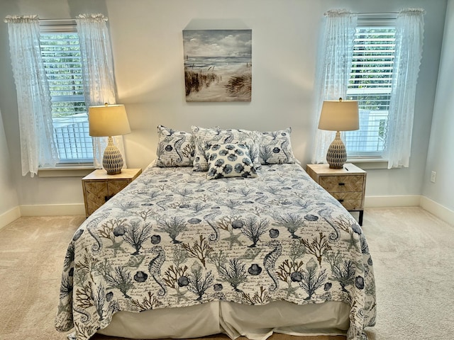 carpeted bedroom with baseboards