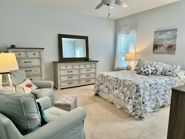 bedroom featuring light carpet and ceiling fan