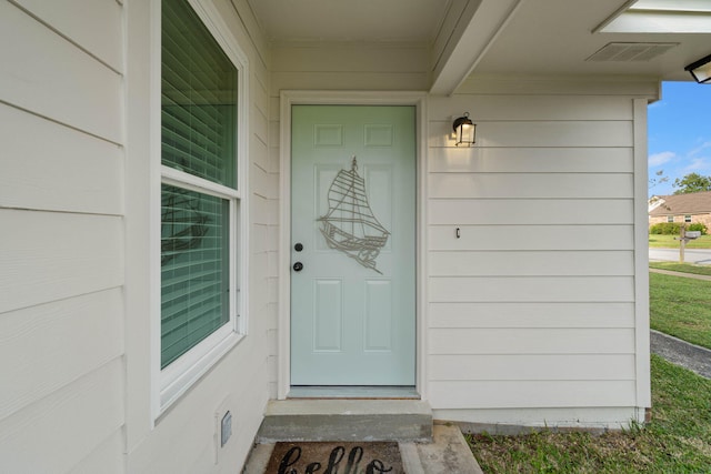 property entrance featuring visible vents