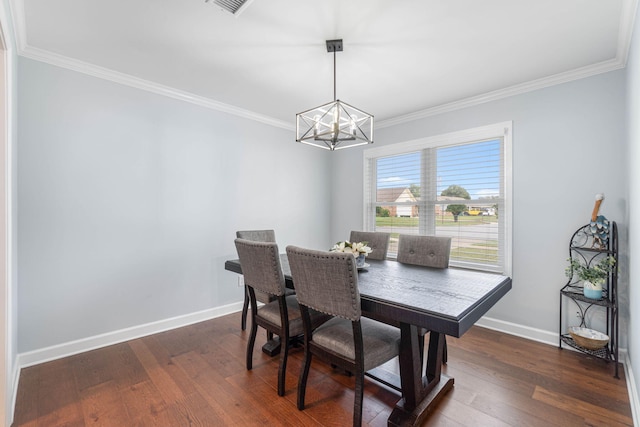 dining area featuring a chandelier, dark wood-type flooring, baseboards, and ornamental molding