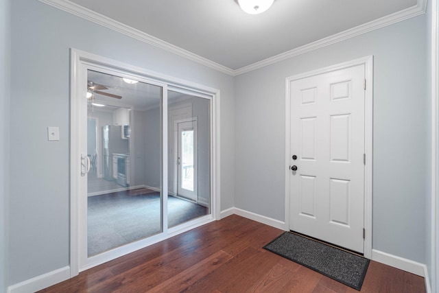 entryway featuring crown molding, baseboards, and dark wood-style flooring