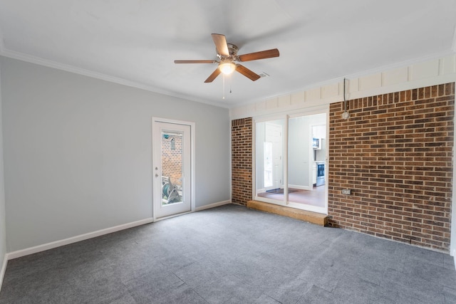 unfurnished room with baseboards, carpet floors, ornamental molding, and a ceiling fan