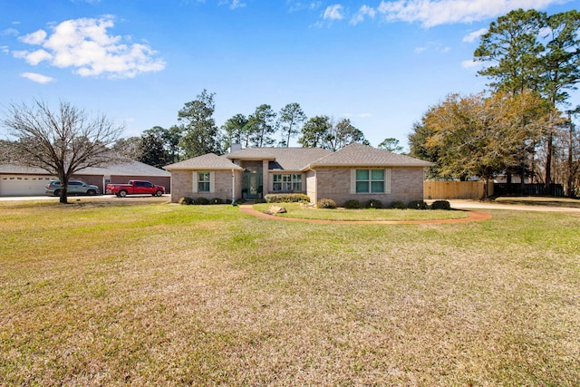 ranch-style home featuring a front lawn, fence, brick siding, and a chimney