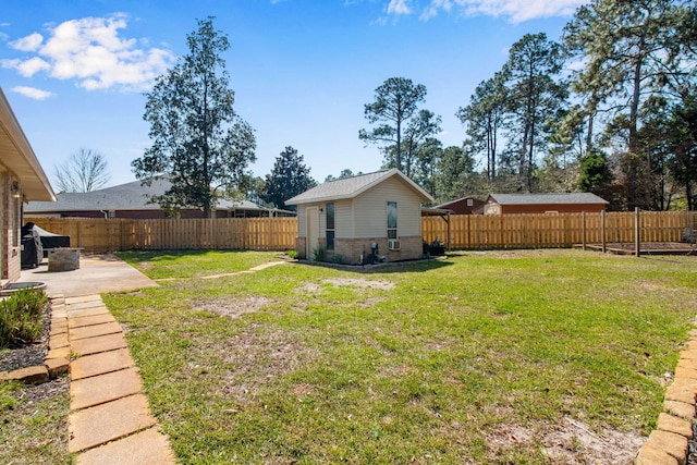 view of yard with a patio and a fenced backyard