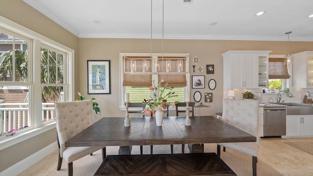 dining space featuring a wealth of natural light, recessed lighting, baseboards, and ornamental molding