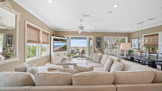 living room with visible vents, recessed lighting, a ceiling fan, and ornamental molding