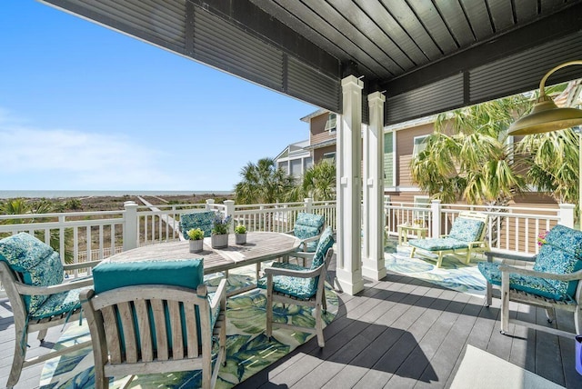 wooden terrace featuring outdoor dining space