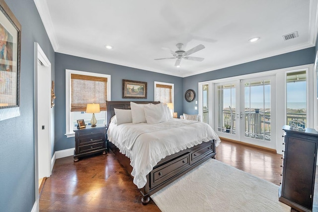 bedroom featuring access to exterior, visible vents, crown molding, french doors, and wood finished floors