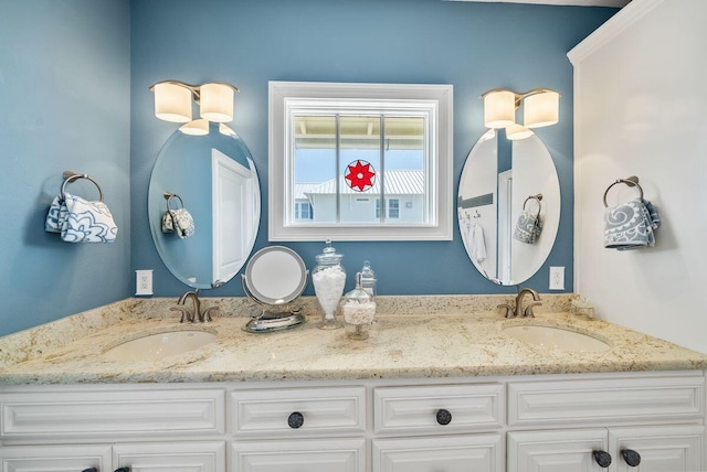 bathroom with a sink and double vanity