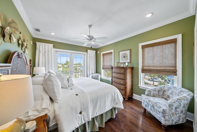 bedroom with visible vents, crown molding, dark wood-style flooring, french doors, and access to outside