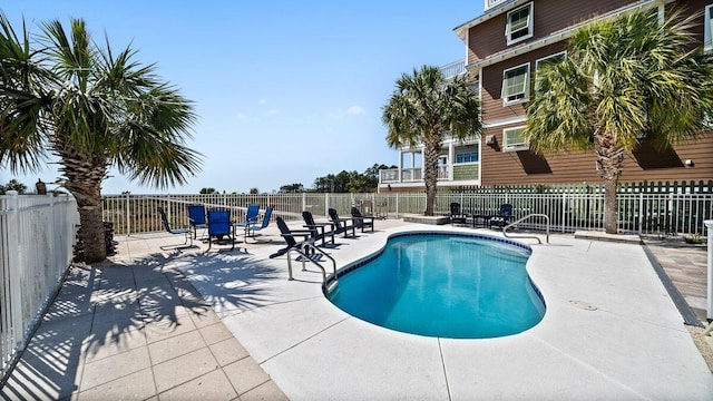 pool featuring a patio and fence