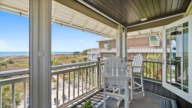 balcony with a water view and a wall unit AC