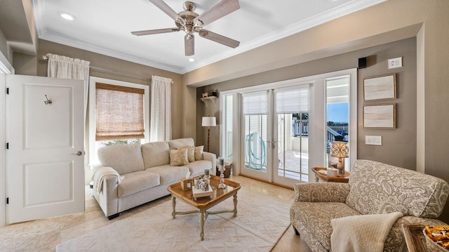 living area with crown molding, french doors, and ceiling fan