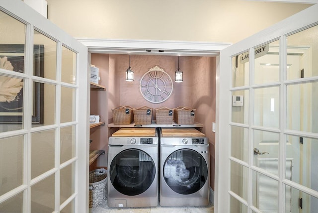 laundry area with washing machine and dryer and laundry area