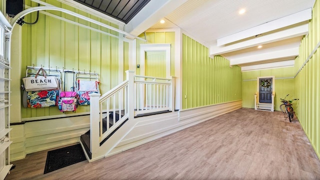 interior space featuring beamed ceiling, recessed lighting, and wood finished floors