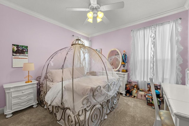 carpeted bedroom with crown molding and a ceiling fan