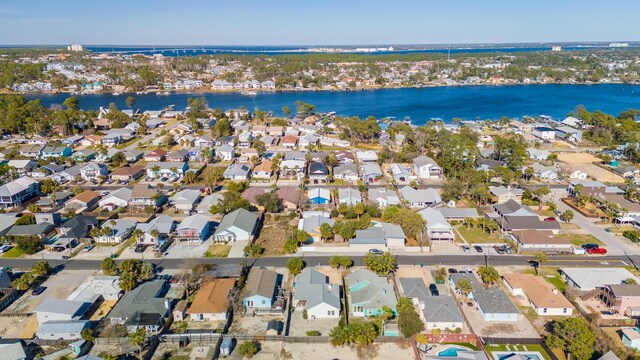 drone / aerial view with a residential view and a water view