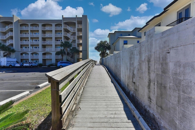 view of community with uncovered parking