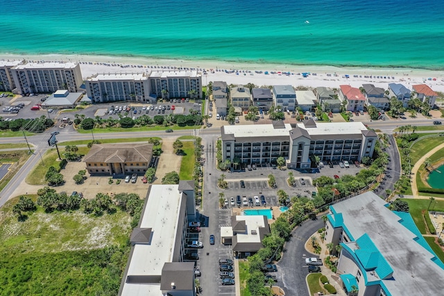 bird's eye view featuring a view of the beach, a view of city, and a water view