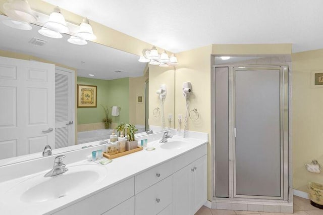 bathroom featuring a sink, visible vents, and a shower stall