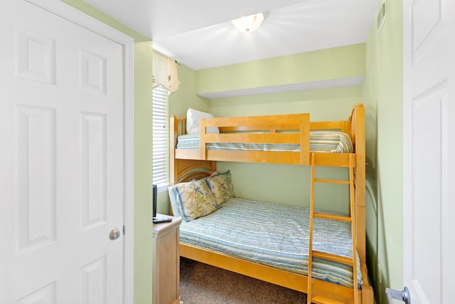 carpeted bedroom with visible vents