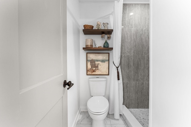 full bathroom featuring a shower stall, toilet, baseboards, and marble finish floor