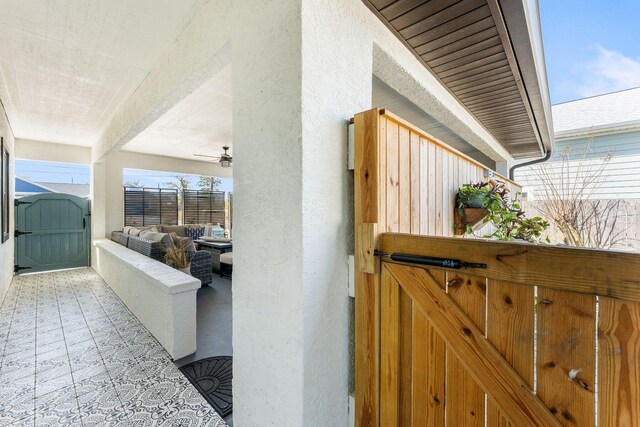 view of patio featuring a gate