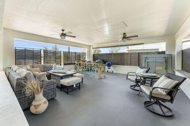 view of patio / terrace with an outdoor hangout area, outdoor dining space, a ceiling fan, and fence