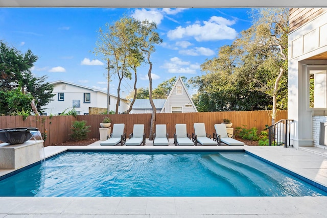 view of swimming pool featuring a patio area, a fenced backyard, and a fenced in pool