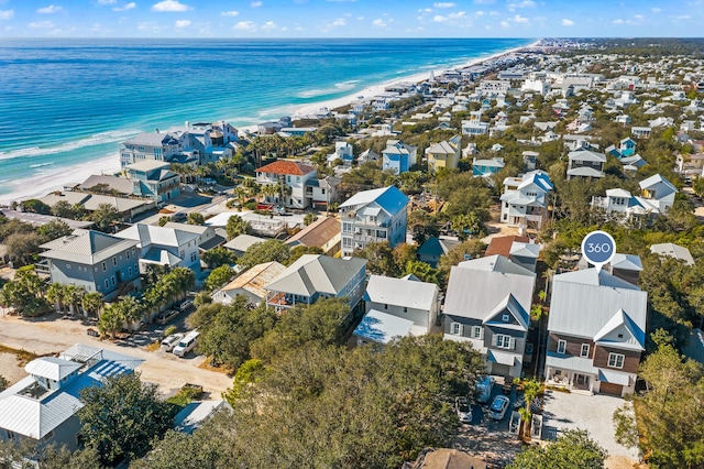 aerial view featuring a residential view, a water view, and a beach view