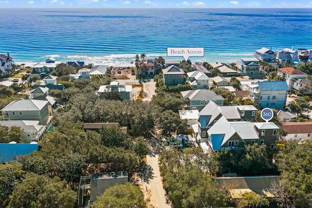 birds eye view of property with a residential view and a water view