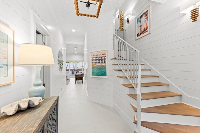 staircase with recessed lighting and tile patterned flooring