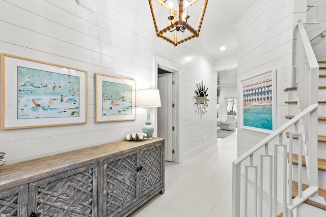 hallway featuring stairway, recessed lighting, and a chandelier