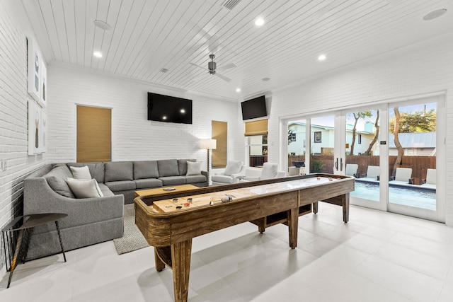 recreation room with recessed lighting, brick wall, wooden ceiling, and ceiling fan