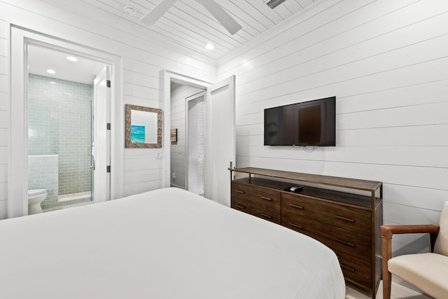 bedroom featuring recessed lighting and connected bathroom