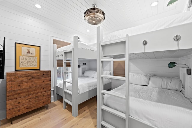 bedroom with wood finished floors, recessed lighting, and wood ceiling