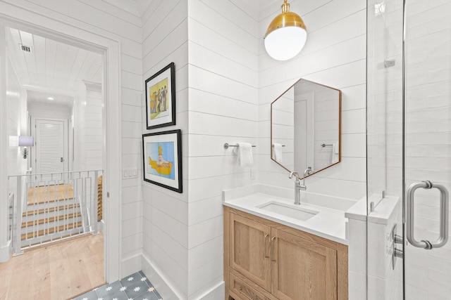 full bathroom featuring visible vents, a stall shower, and vanity