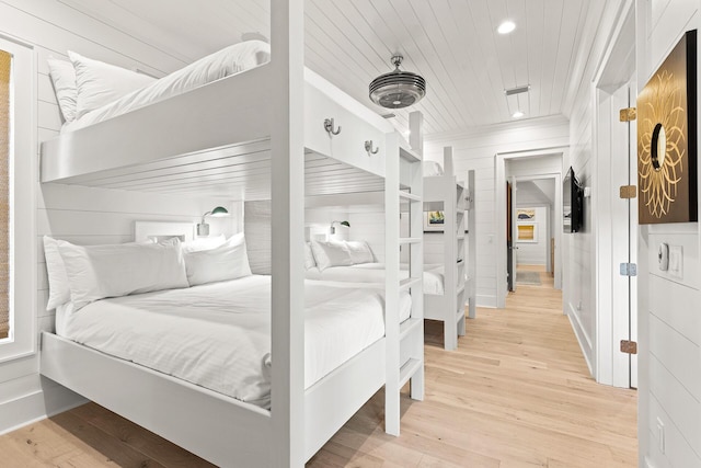 bedroom featuring crown molding, light wood-style flooring, recessed lighting, and wood ceiling